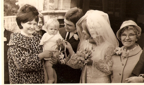 Aunty chris wearing the vintage coat at my parents wedding with nana behind
